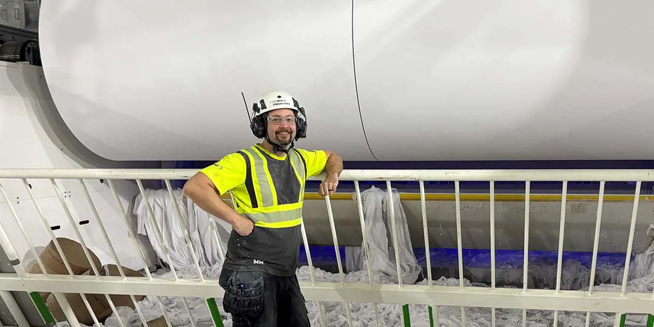 Tobias Berg in front of a Valmet tissue machine